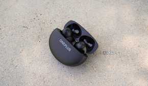 OnePlus Buds Pro 3 in their case half opened.