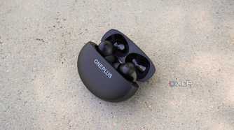OnePlus Buds Pro 3 in their case half opened.