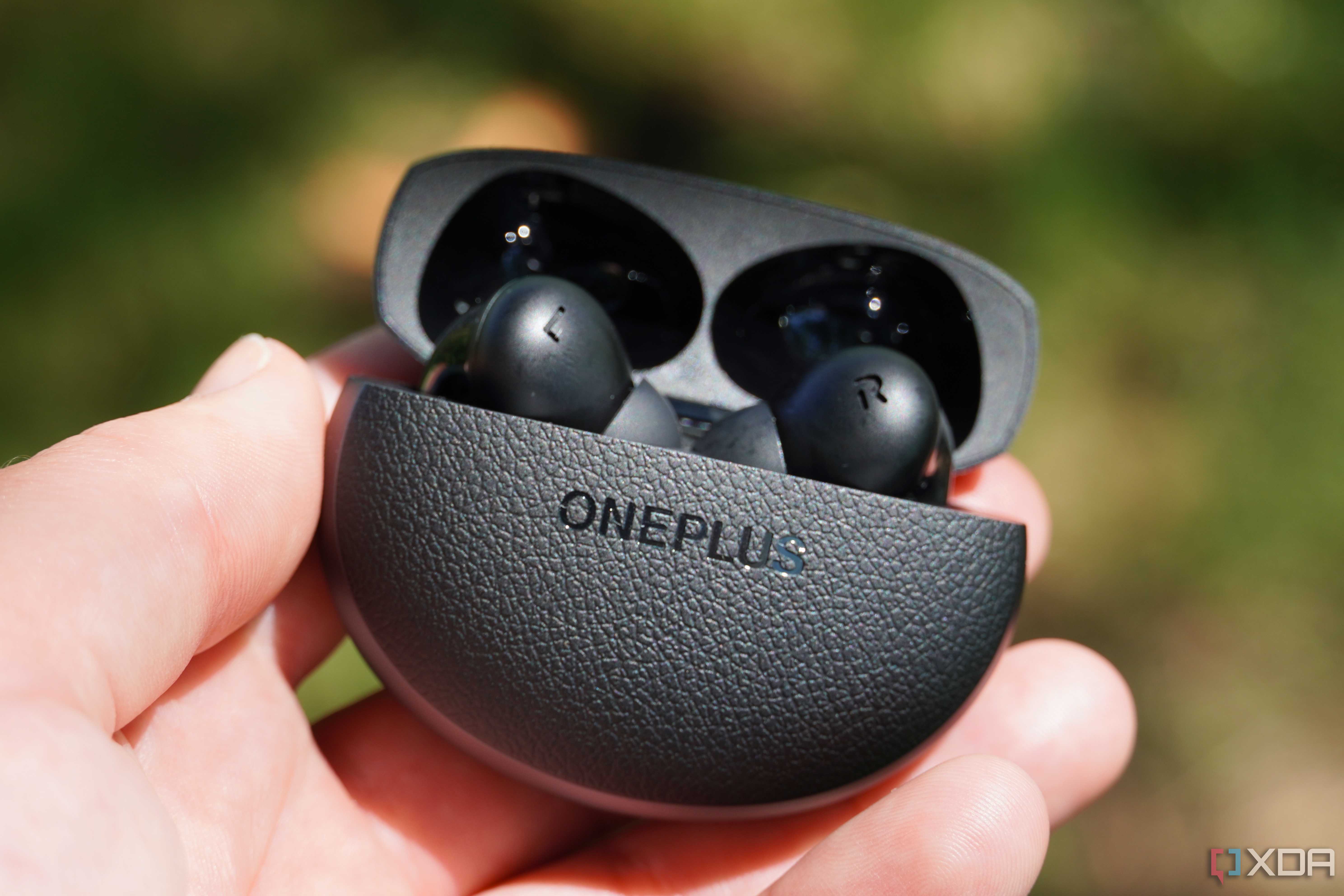 The OnePlus Buds Pro 3 in the hand.