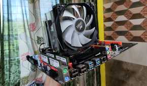 A person holding a dual Xeon X99 motherboard