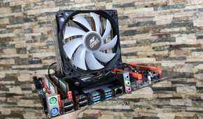 A person holding a dual Xeon X99 motherboard