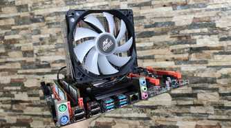 A person holding a dual Xeon X99 motherboard
