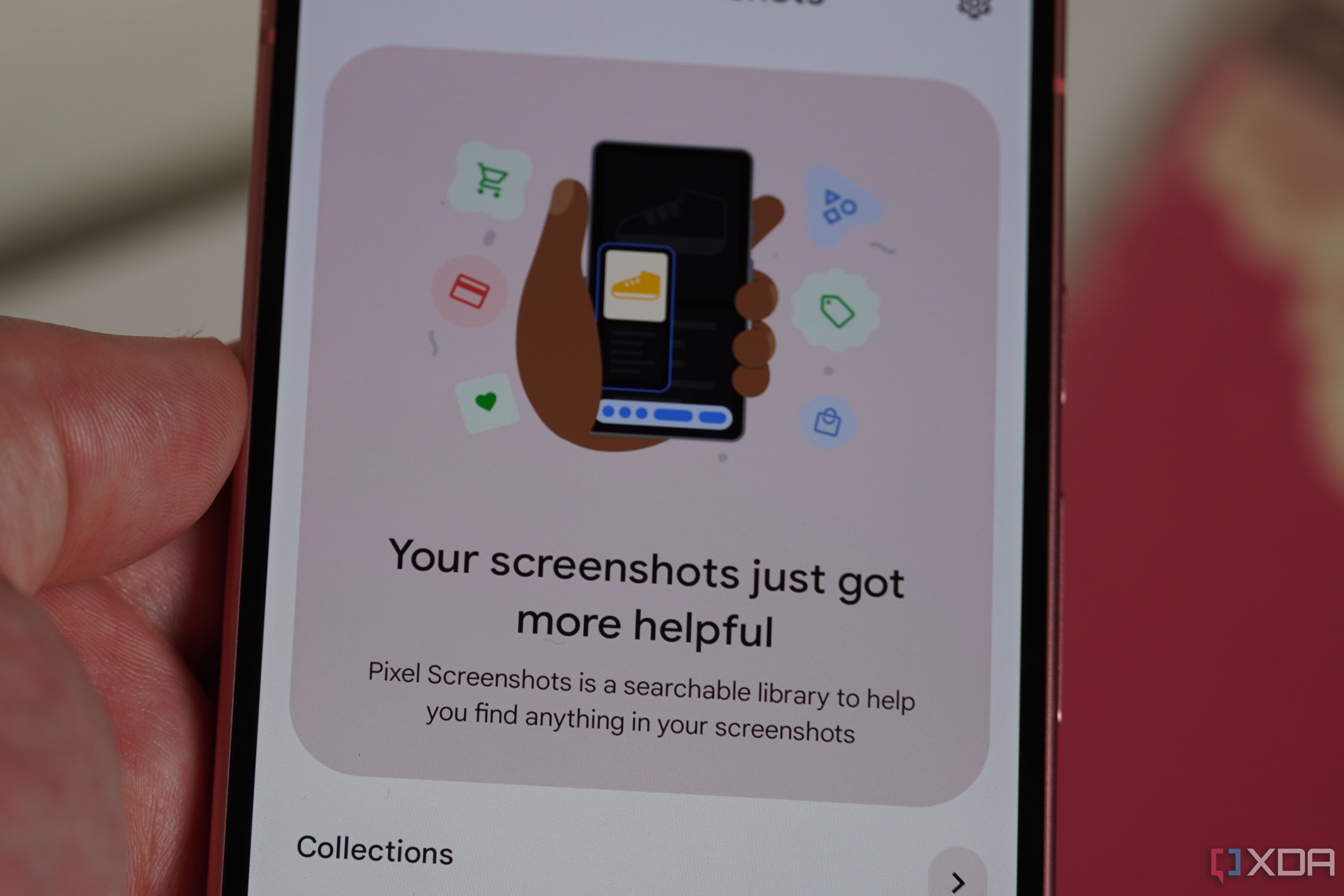 The Pixel Screenshots app on a Pixel in-hand.