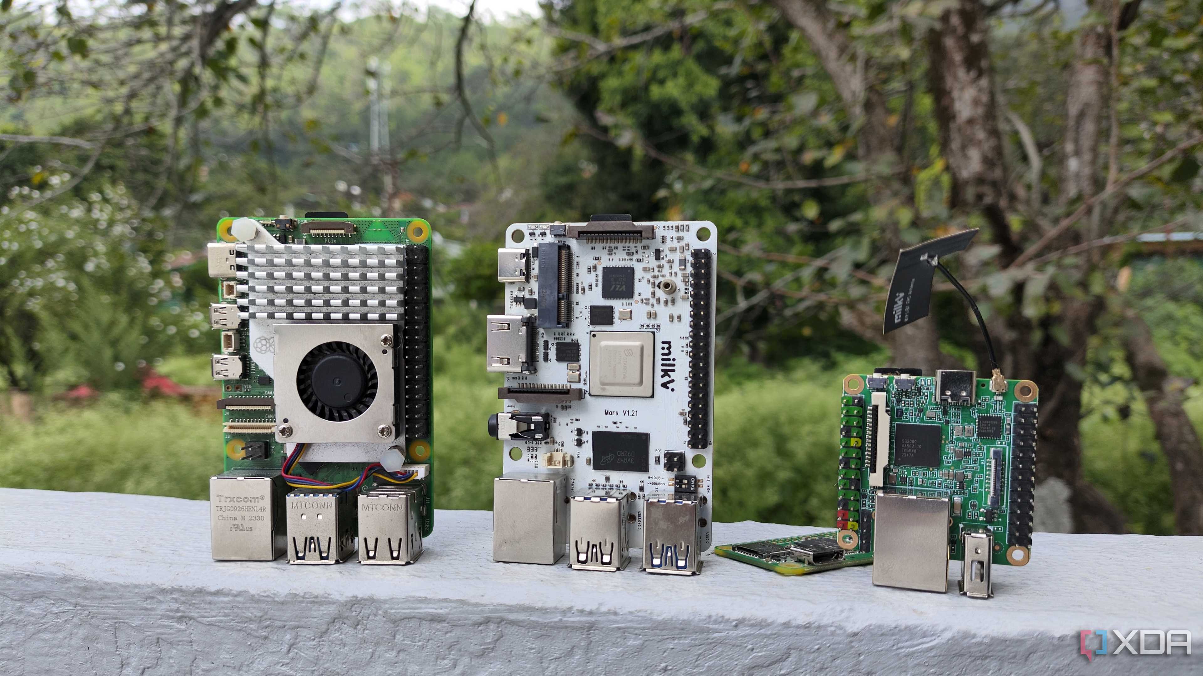 Raspberry Pi 5 and Zero W kept near the Milk-V Duo S and Mars SBCs
