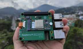 A person holding the Raspberry Pi AI Kit