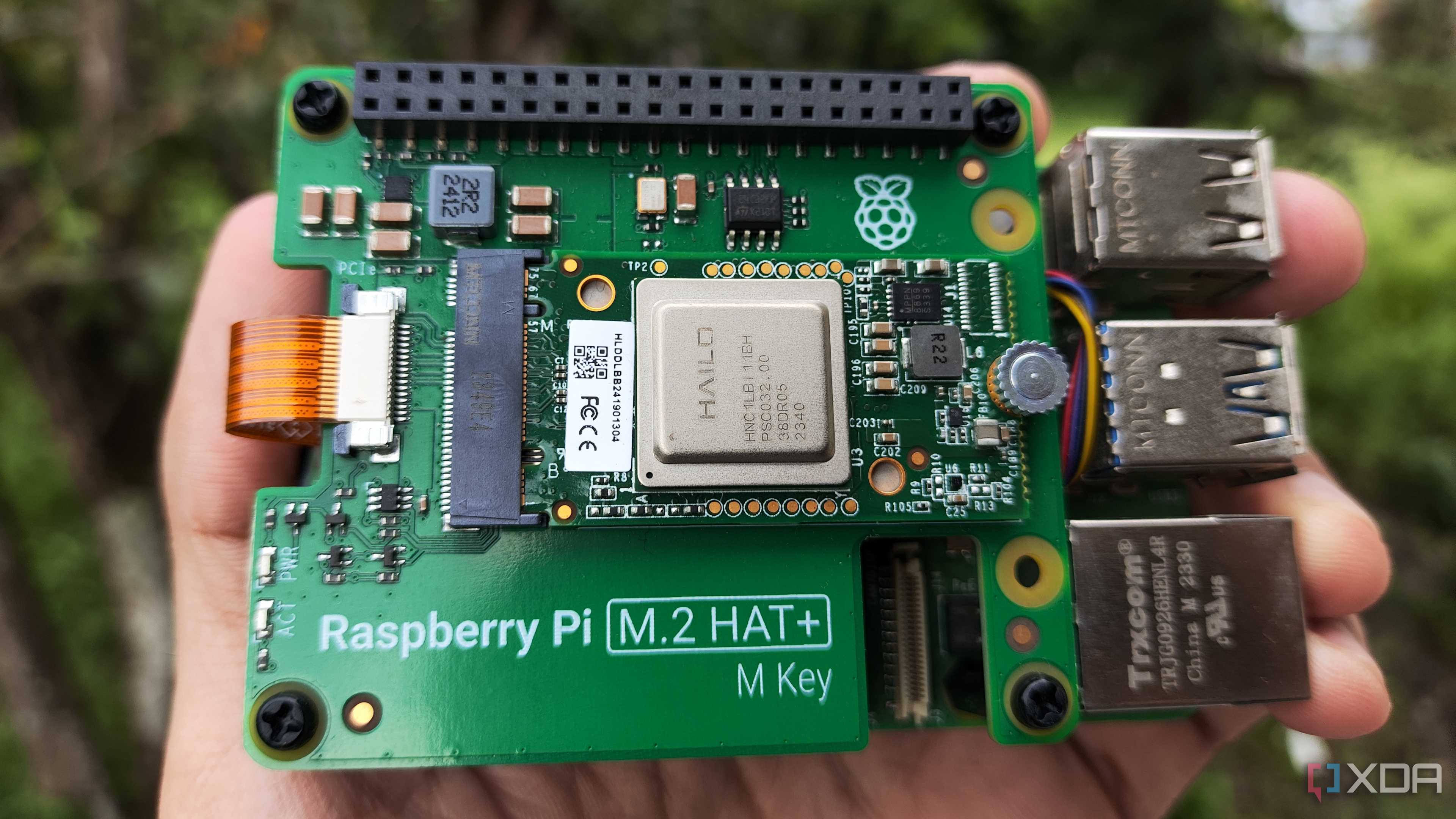 A person holding the Raspberry Pi AI Kit