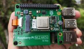 A person holding the Raspberry Pi AI Kit