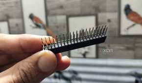 A person holding a GPIO stacking header