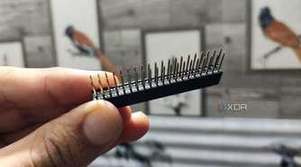 A person holding a GPIO stacking header