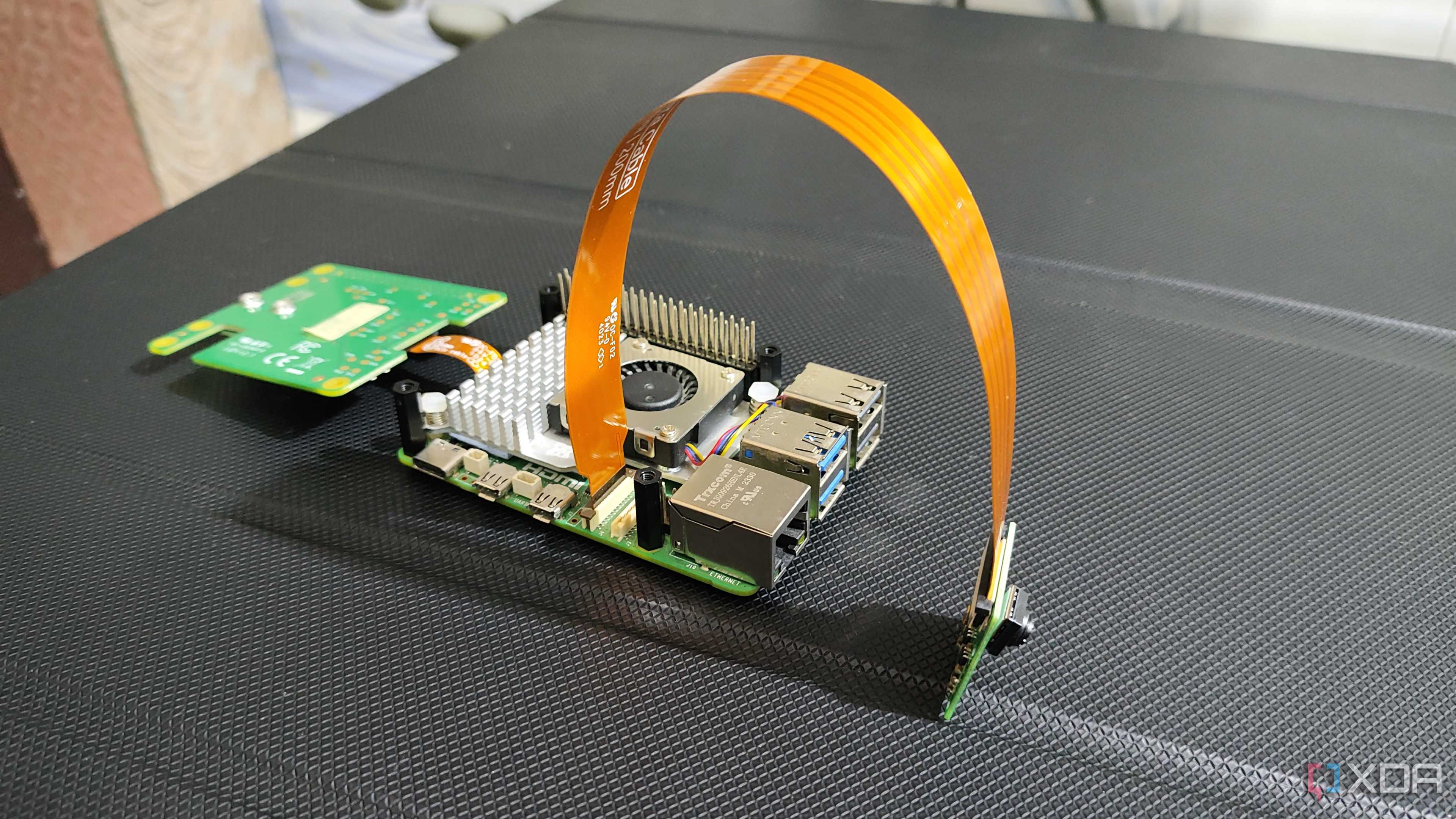 The Raspberry Pi AI Kit connected to a camera module