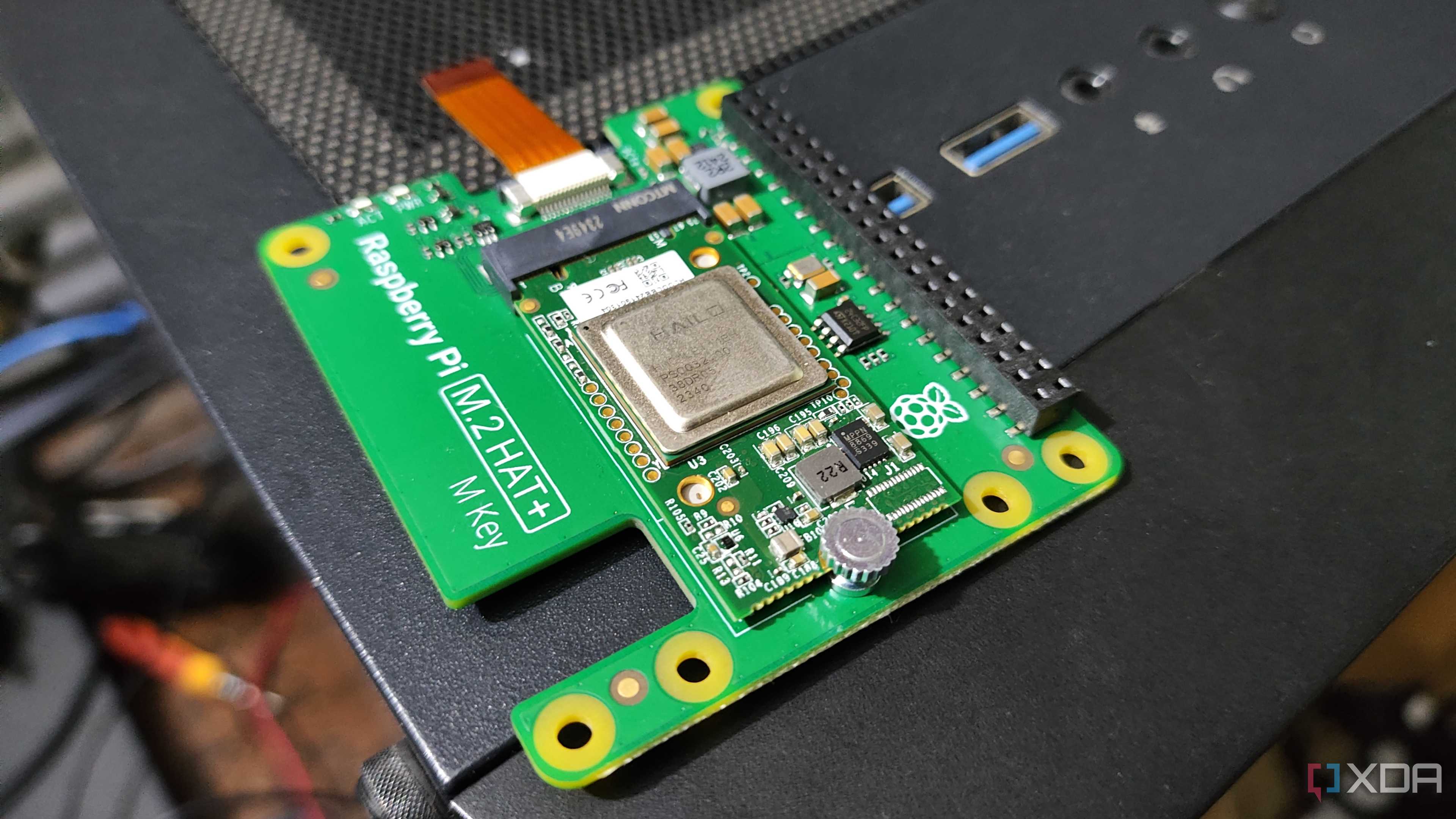 A Raspberry Pi 5 AI Kit resting on a PC