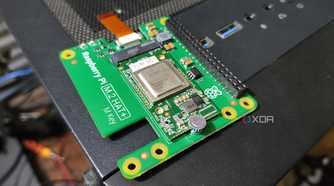 A Raspberry Pi 5 AI Kit resting on a PC
