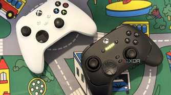 razer wolverine v3 pro controller on desk next to white xbox controller