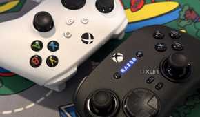 razer wolverine v3 pro controller close up next to white xbox controller