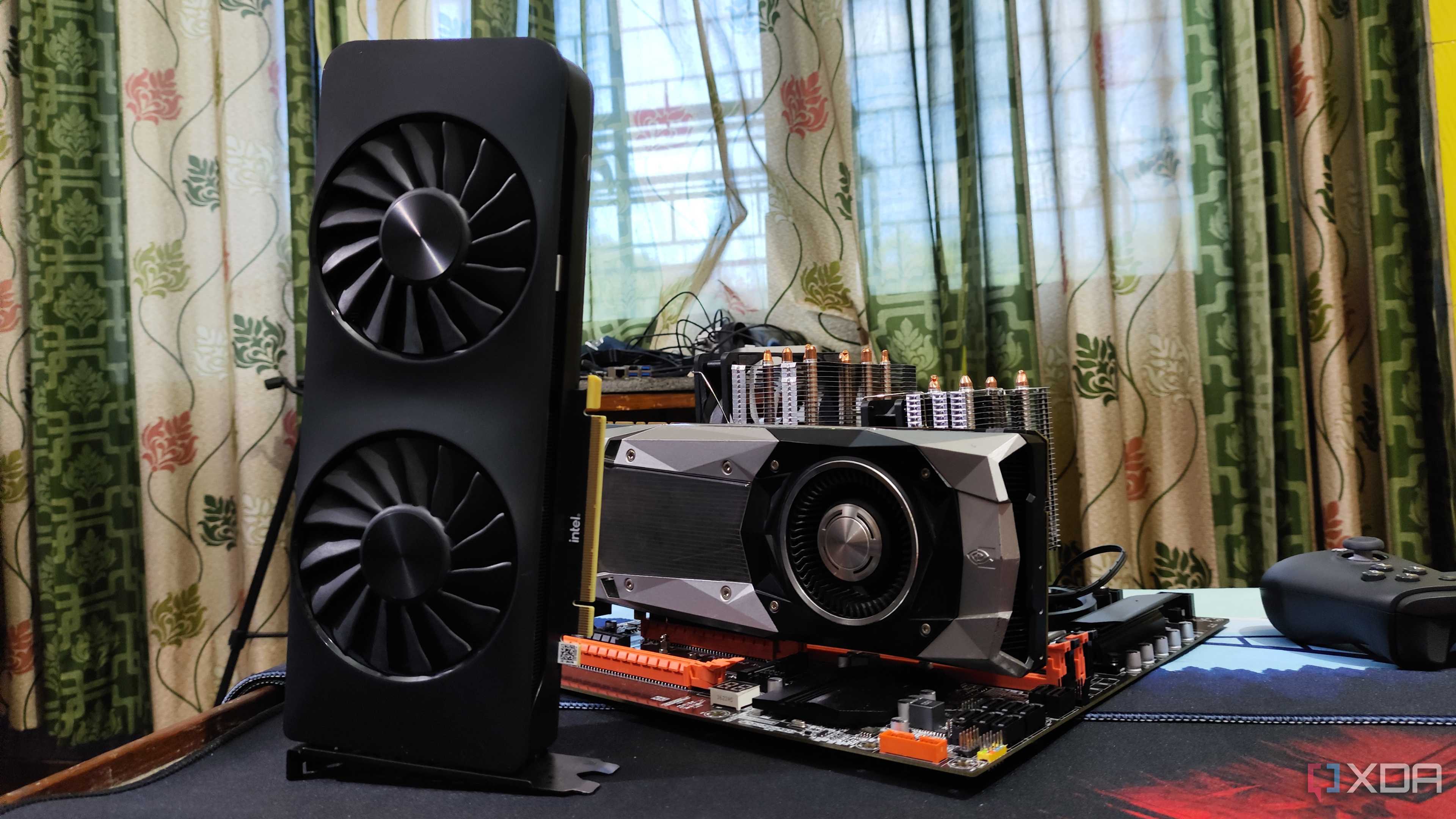 An Intel Arc A750, with a dual-Xeon X99 motherboard lying nearby