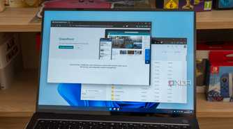 A Windows 11 laptop displaying the SharePoint product page and files in oneDrive