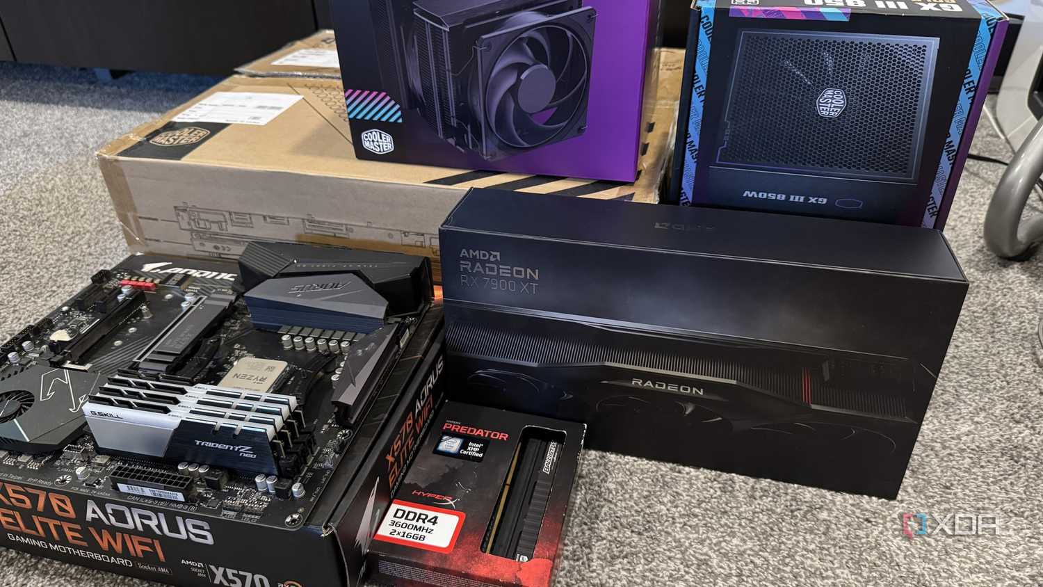 stack of pc hardware components and boxes