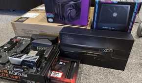 stack of pc hardware components and boxes