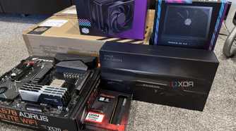 stack of pc hardware components and boxes