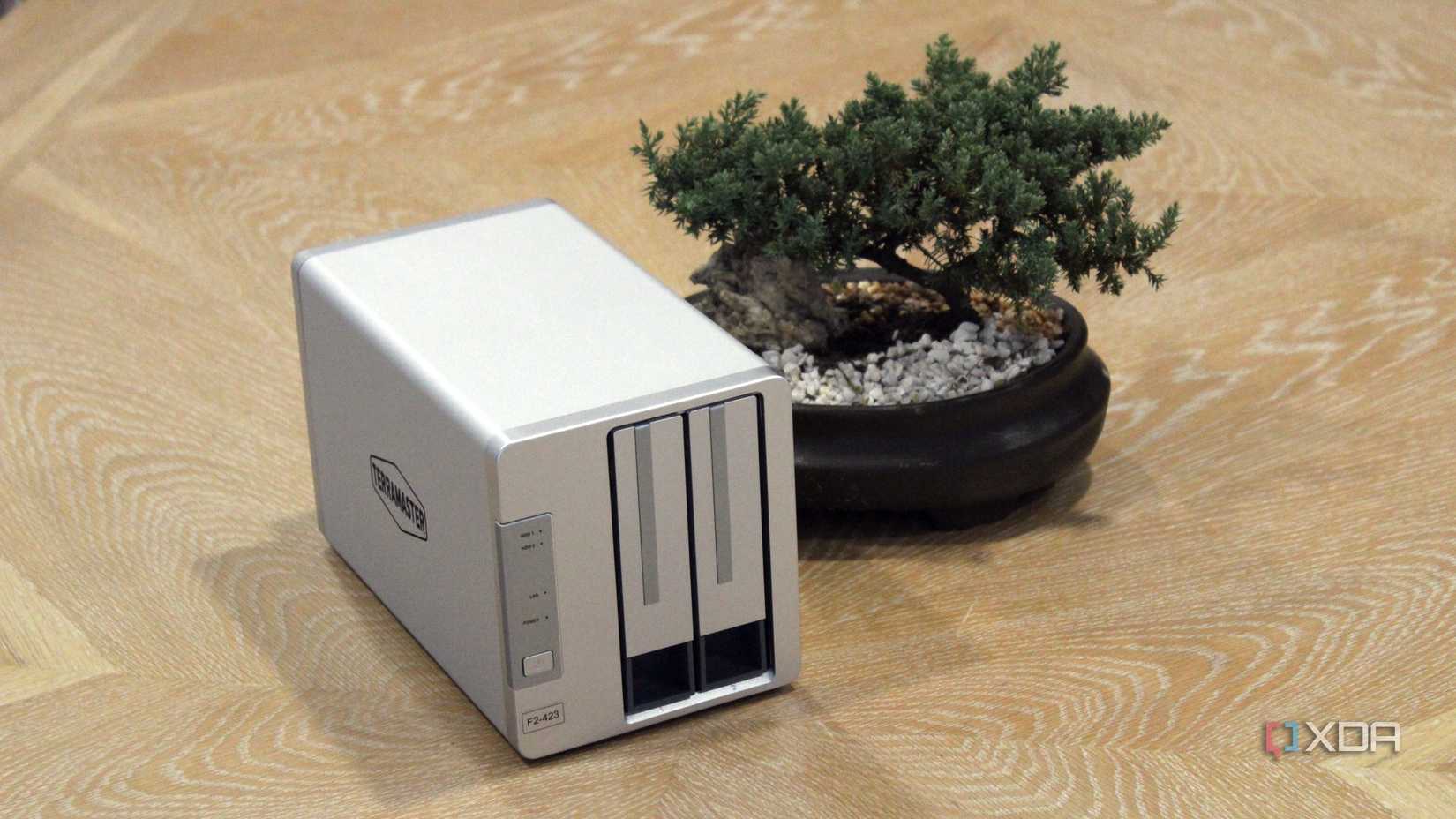 TerraMaster F2-423 NAS on a table next to a bonsai