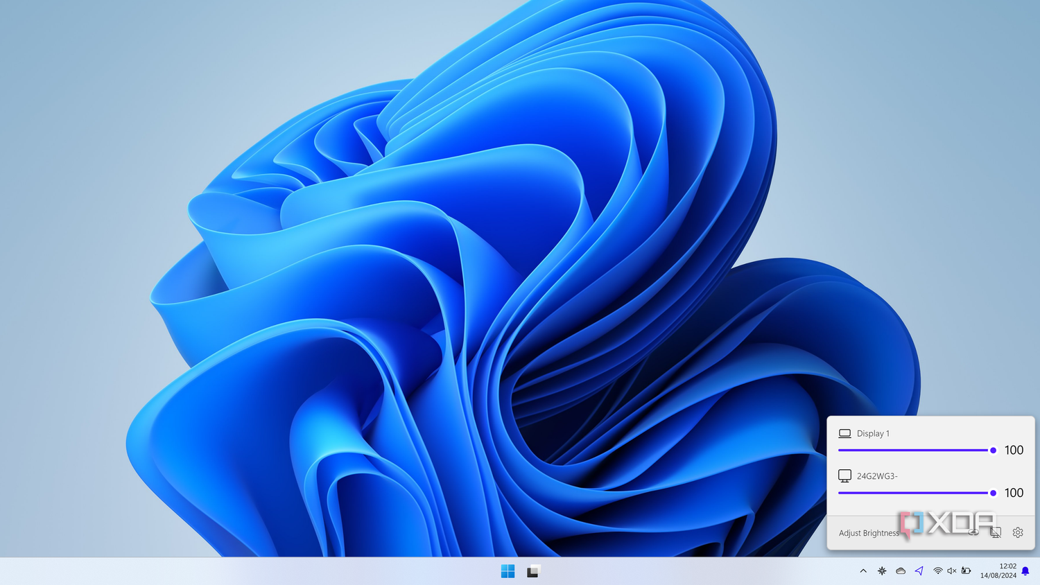 Screenshot of WIndows 11 with the Twinkle Tray flyout showing brightness sliders for two monitors