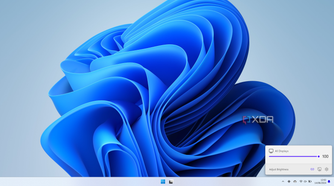 Screenshot of a Windows 11 desktop with a unified slider for all connected displays in the Twinkle Tray flyout