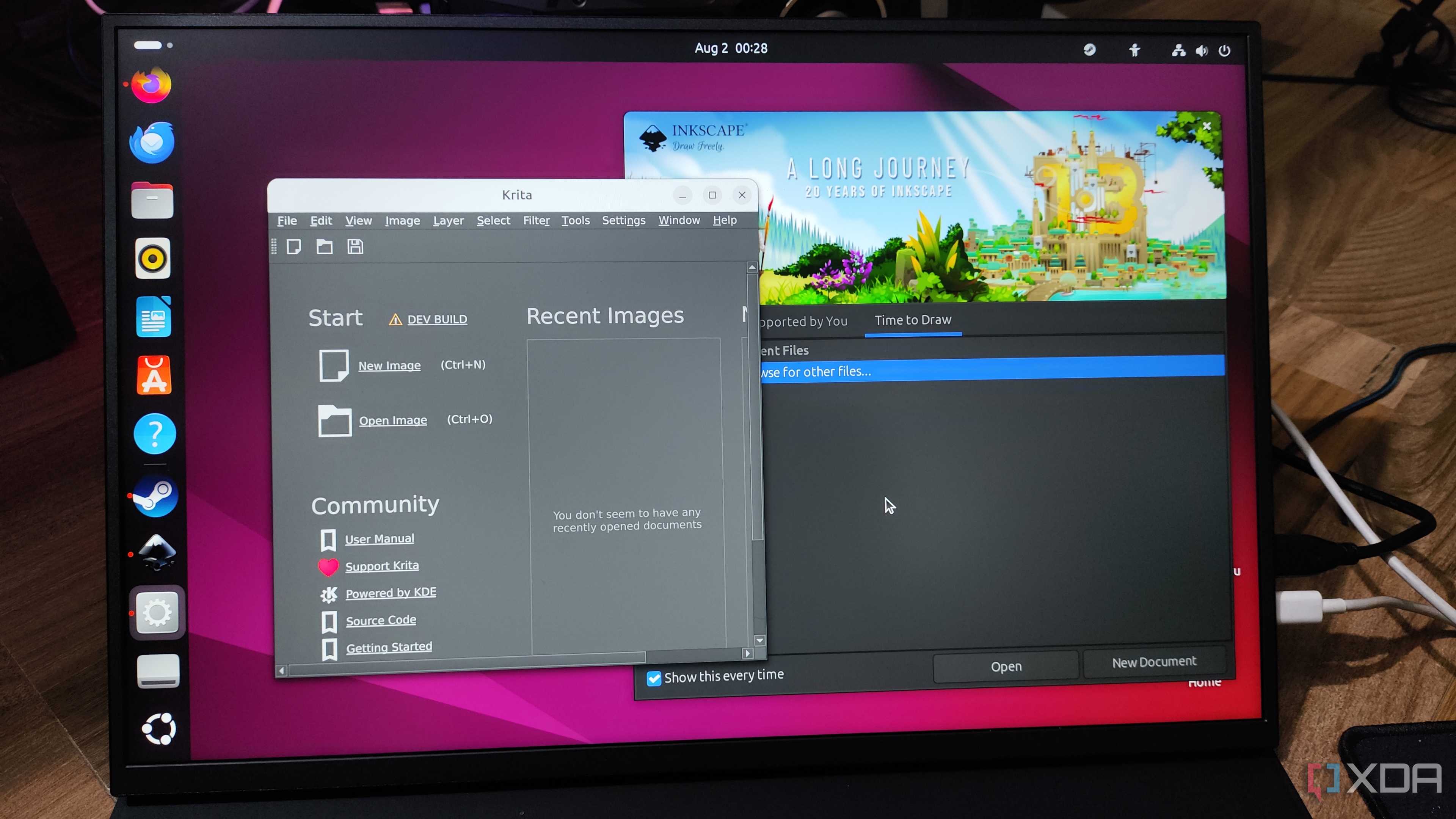 A Uperfect UGame K118 monitor displaying the Inkscape and Krita UI