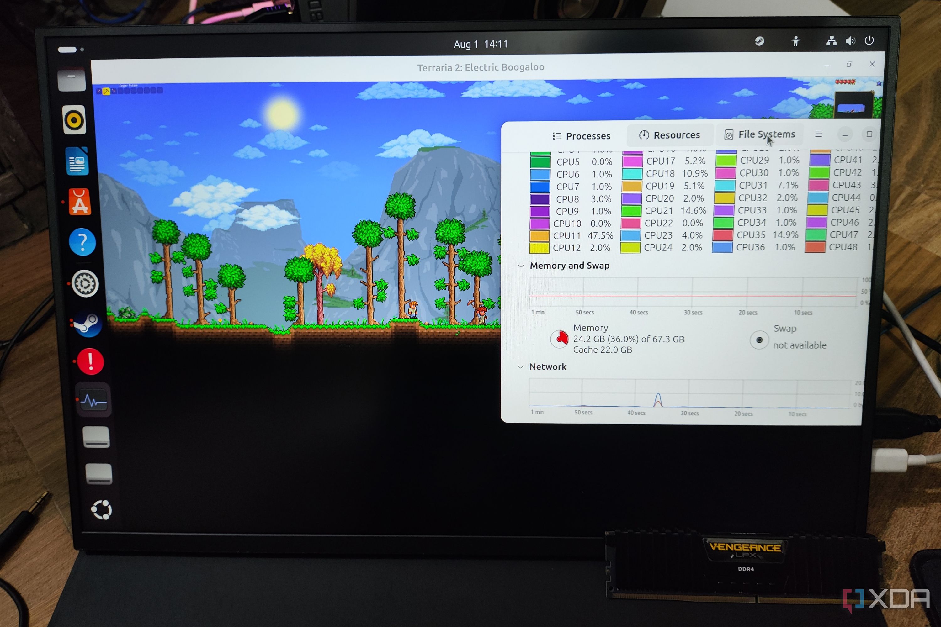 A Uperfect UGame K118 monitor running Terraria, with a Corsair DDR4 memory lying nearby