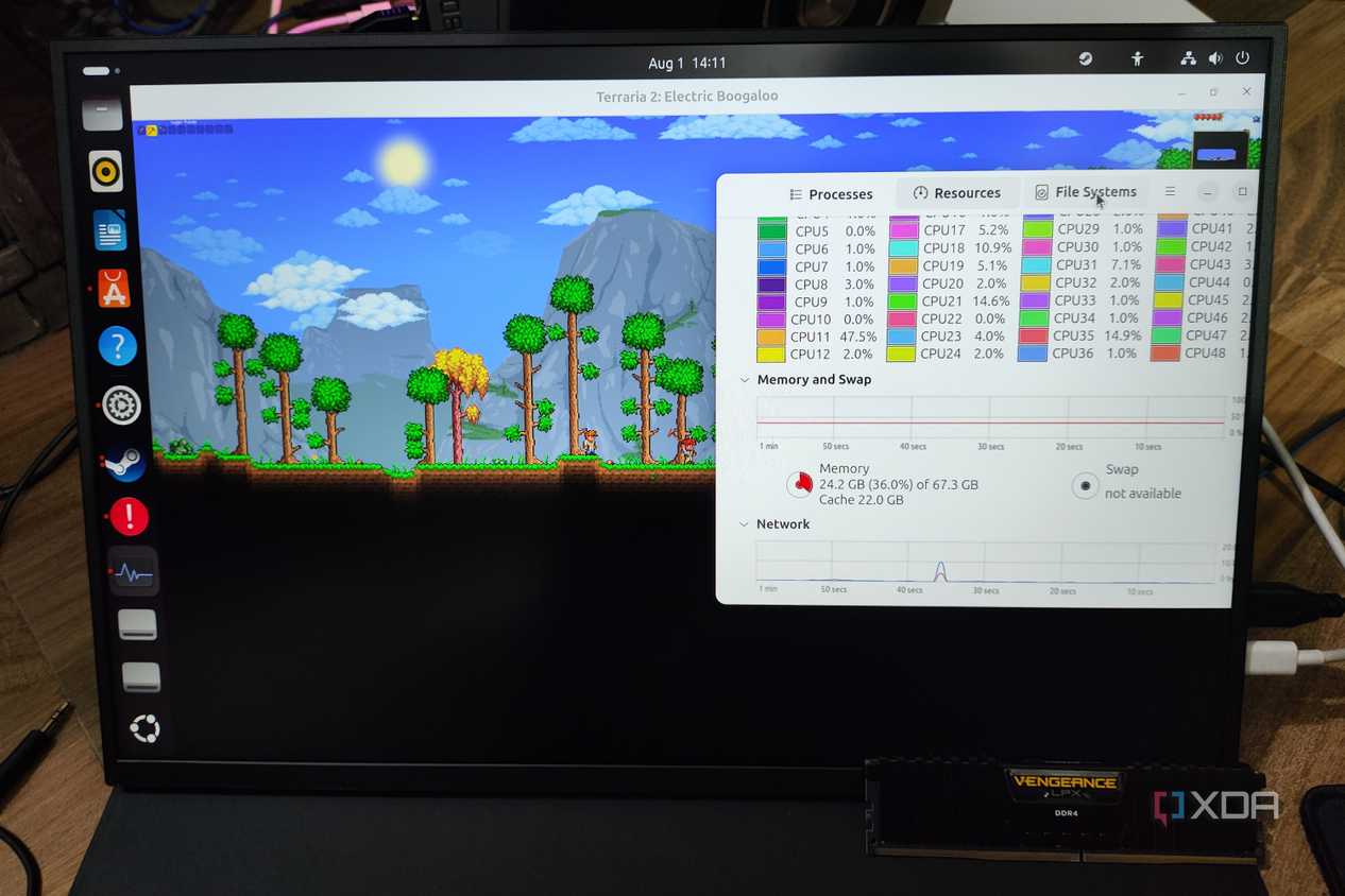 A Uperfect UGame K118 monitor running Terraria, with a Corsair DDR4 memory lying nearby