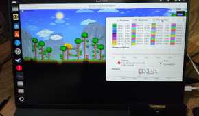 A Uperfect UGame K118 monitor running Terraria, with a Corsair DDR4 memory lying nearby