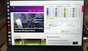 A Uperfect UGame K118 monitor displaying the XDA homepage and the Ubuntu Resource Monitor