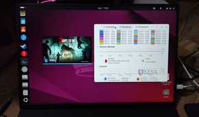A Uperfect UGame K118 displaying the 7 Days to Die initialization screen and the Ubuntu Resource Monitor