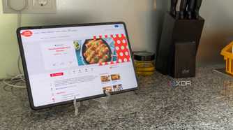 A tablet showing a recipe next to other kitchen kitchen tools