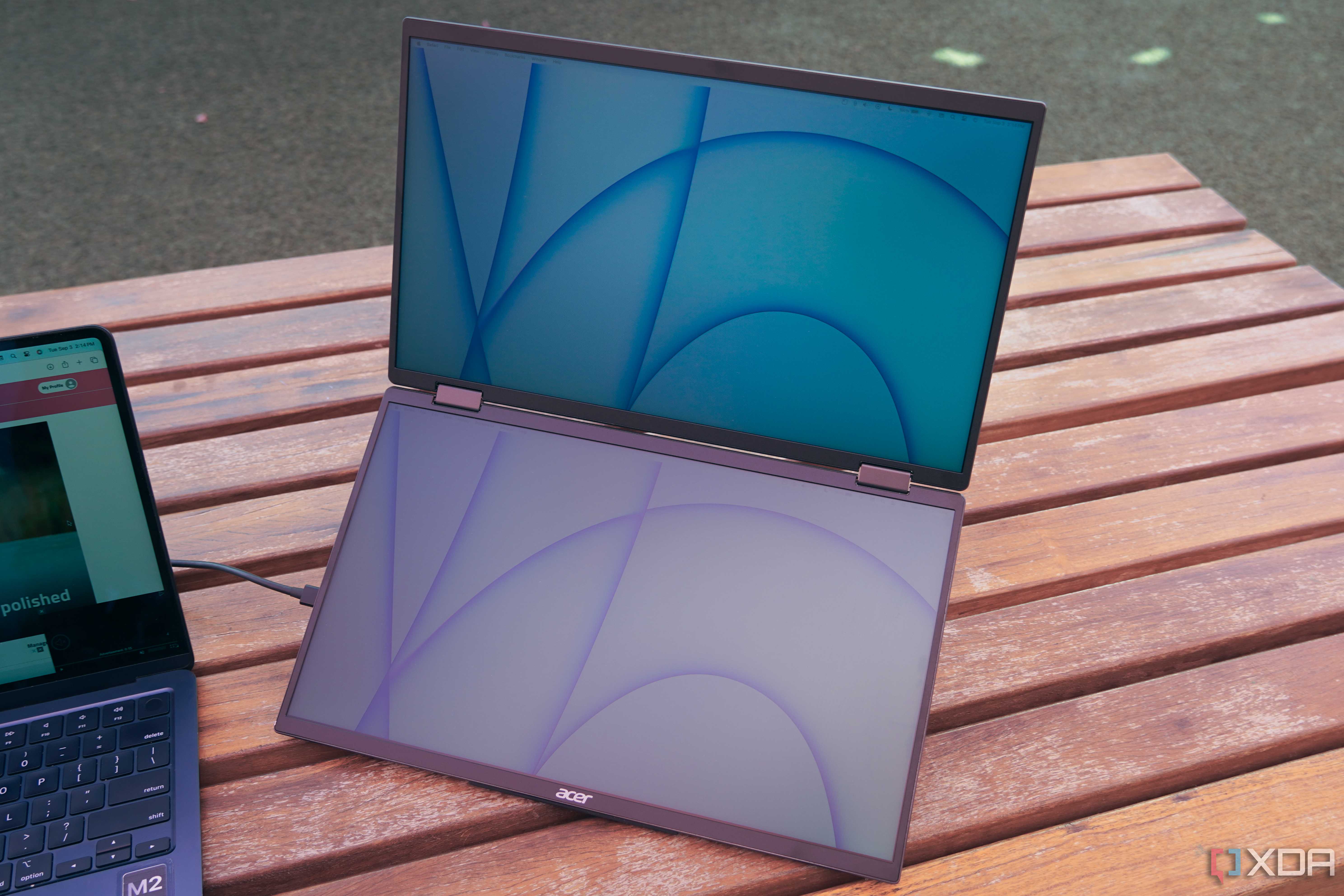 The Acer dual portable monitor on a wooden table.