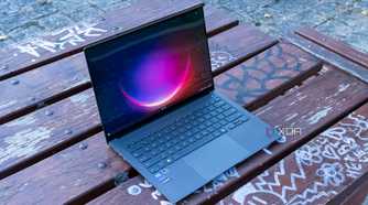 Angled view of the Asus Zenbook S 14 showing the Windows 11 desktop