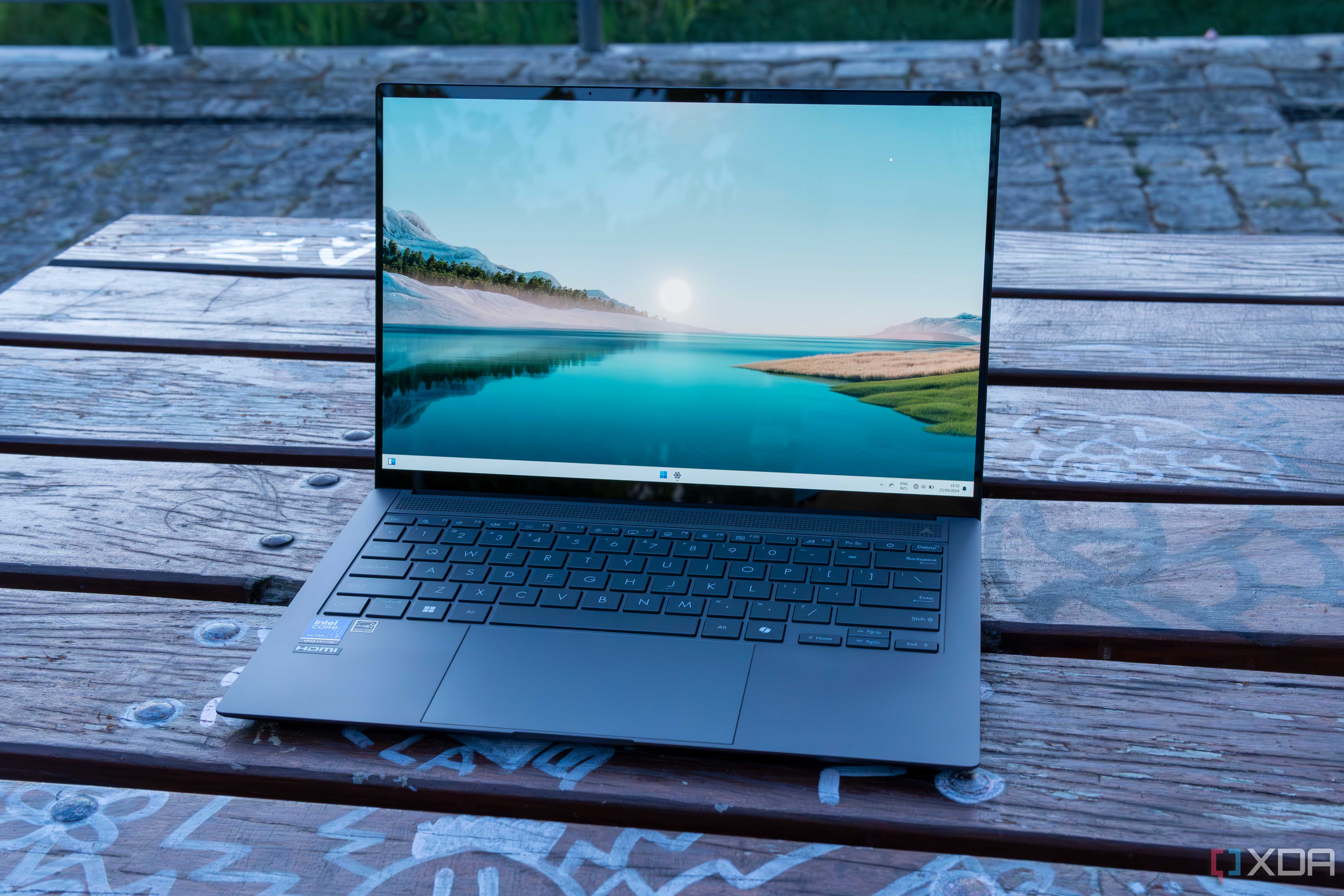 Angled front view of the Asus Zenbook S 14 displaying the Windows 11 desktop