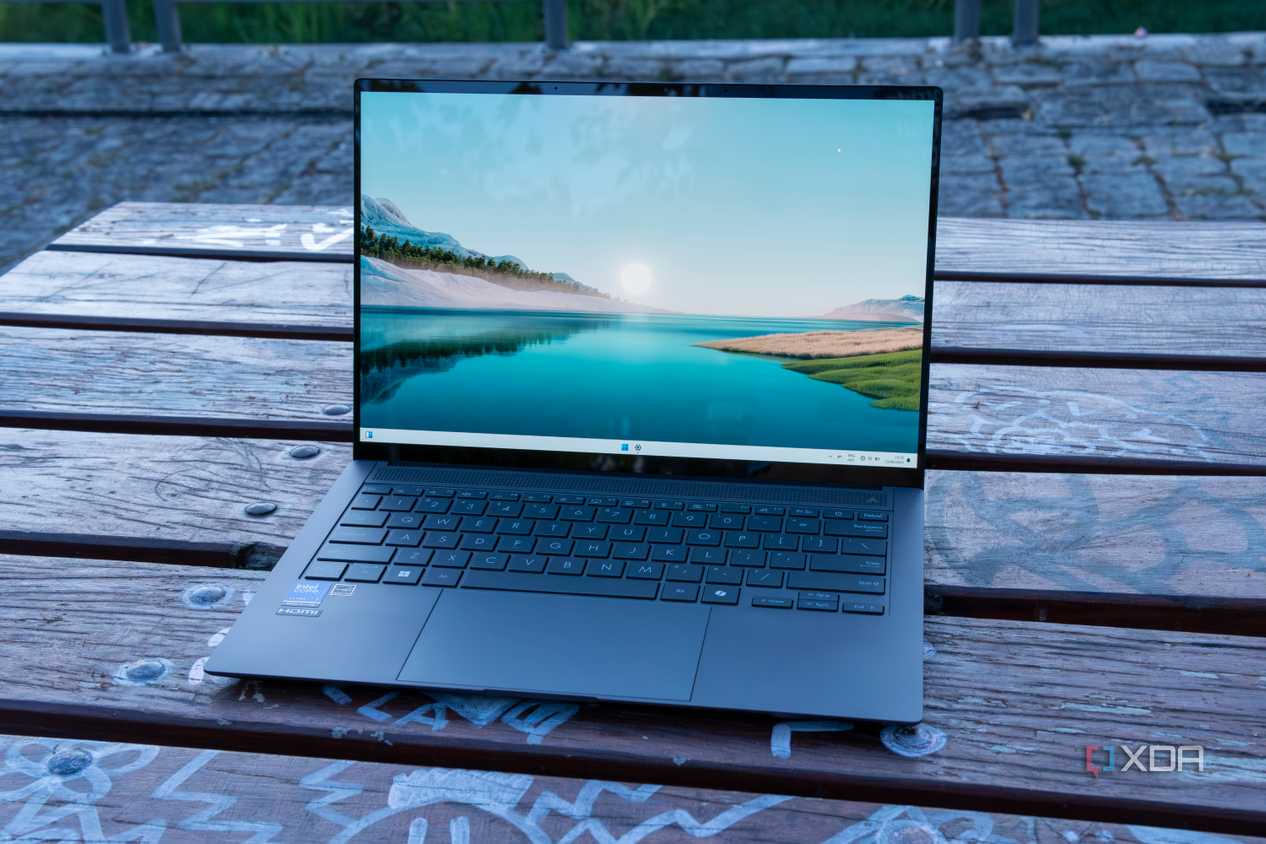 Angled front view of the Asus Zenbook S 14 displaying the Windows 11 desktop