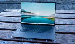 Angled front view of the Asus Zenbook S 14 displaying the Windows 11 desktop