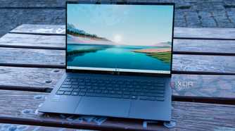 Angled front view of the Asus Zenbook S 14 displaying the Windows 11 desktop
