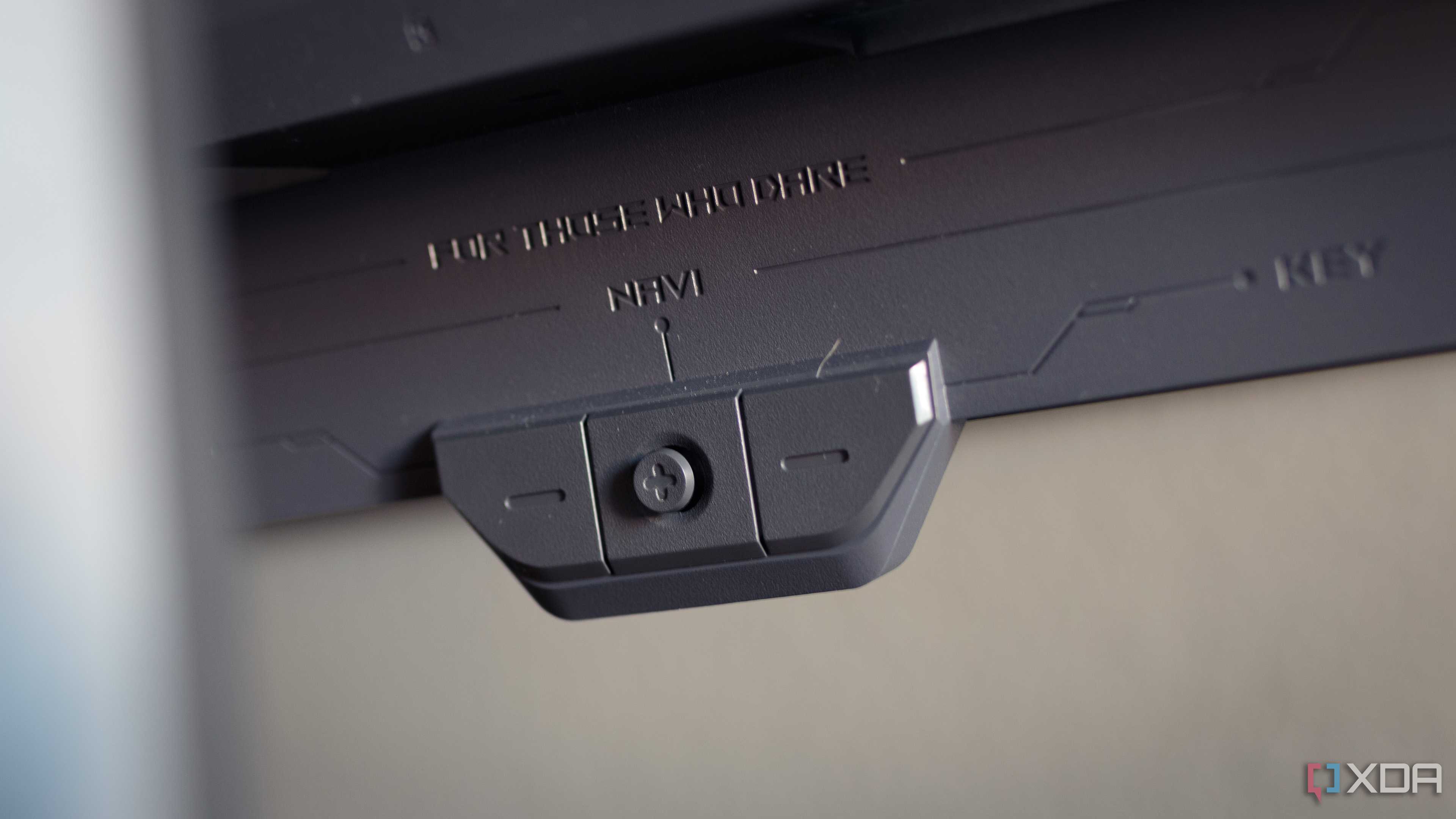 The navi-key of the ASUS ROG PG32UCDP.