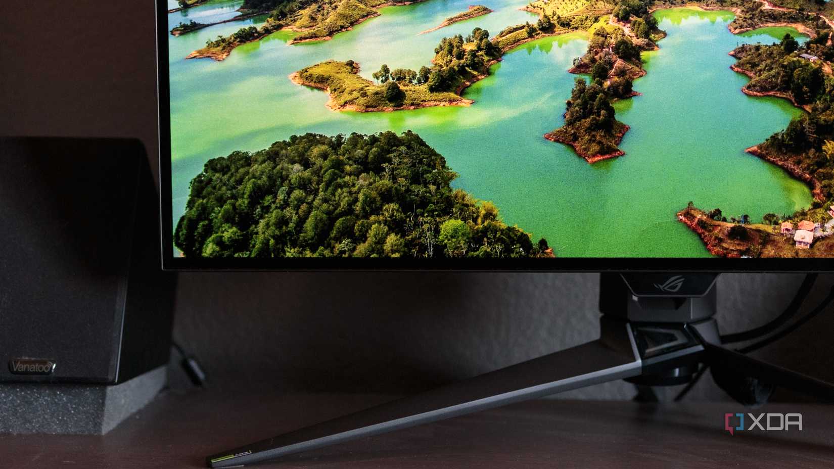 The bottom left of the ASUS ROG PG32UCDP showing a wallpaper.