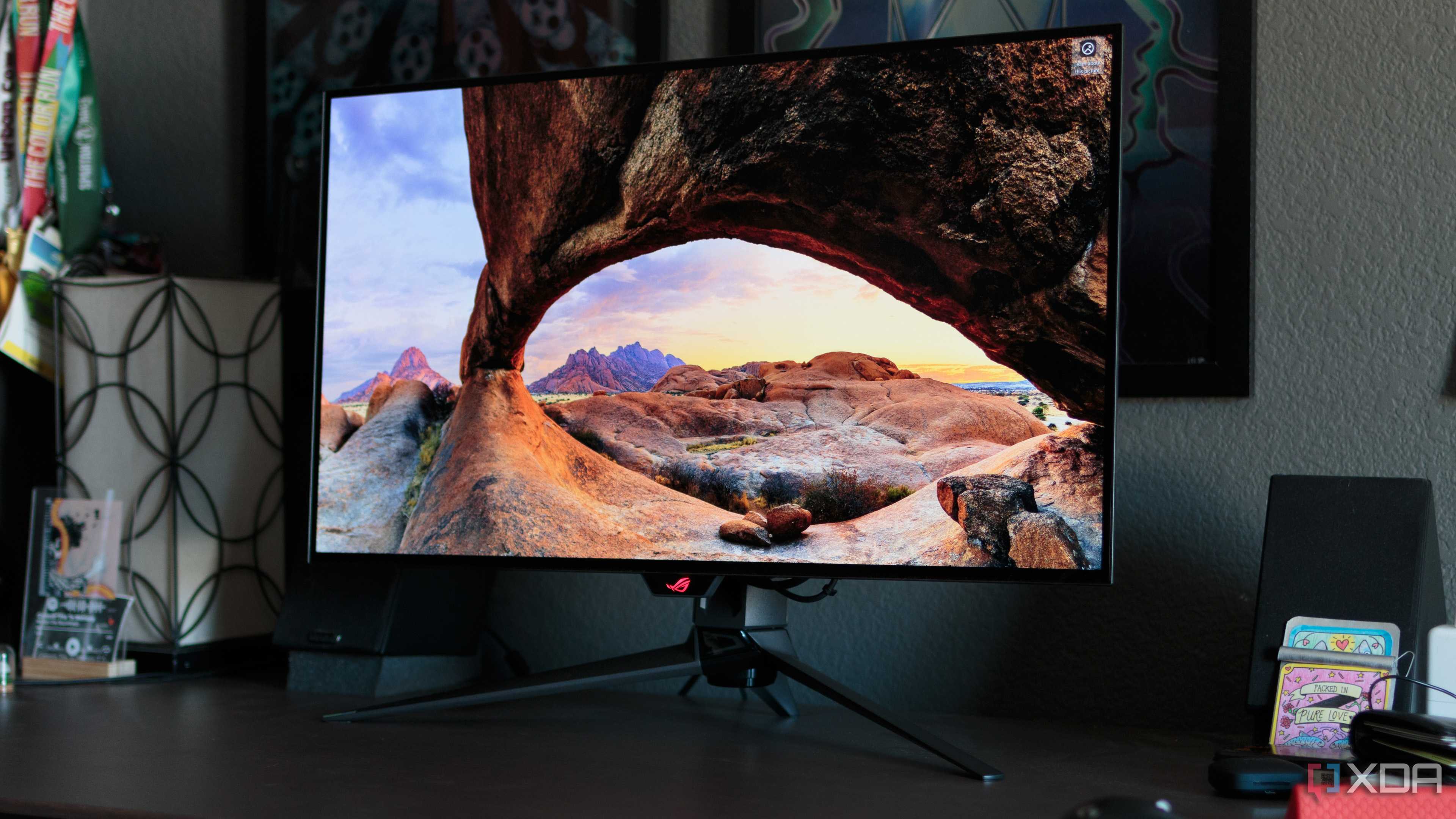 A scenic wallpaper shown on the ASUS ROG PG32UCDP