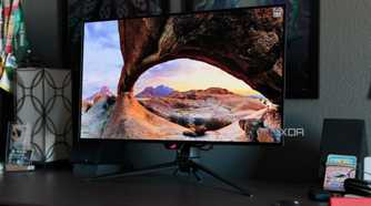 A scenic wallpaper shown on the ASUS ROG PG32UCDP