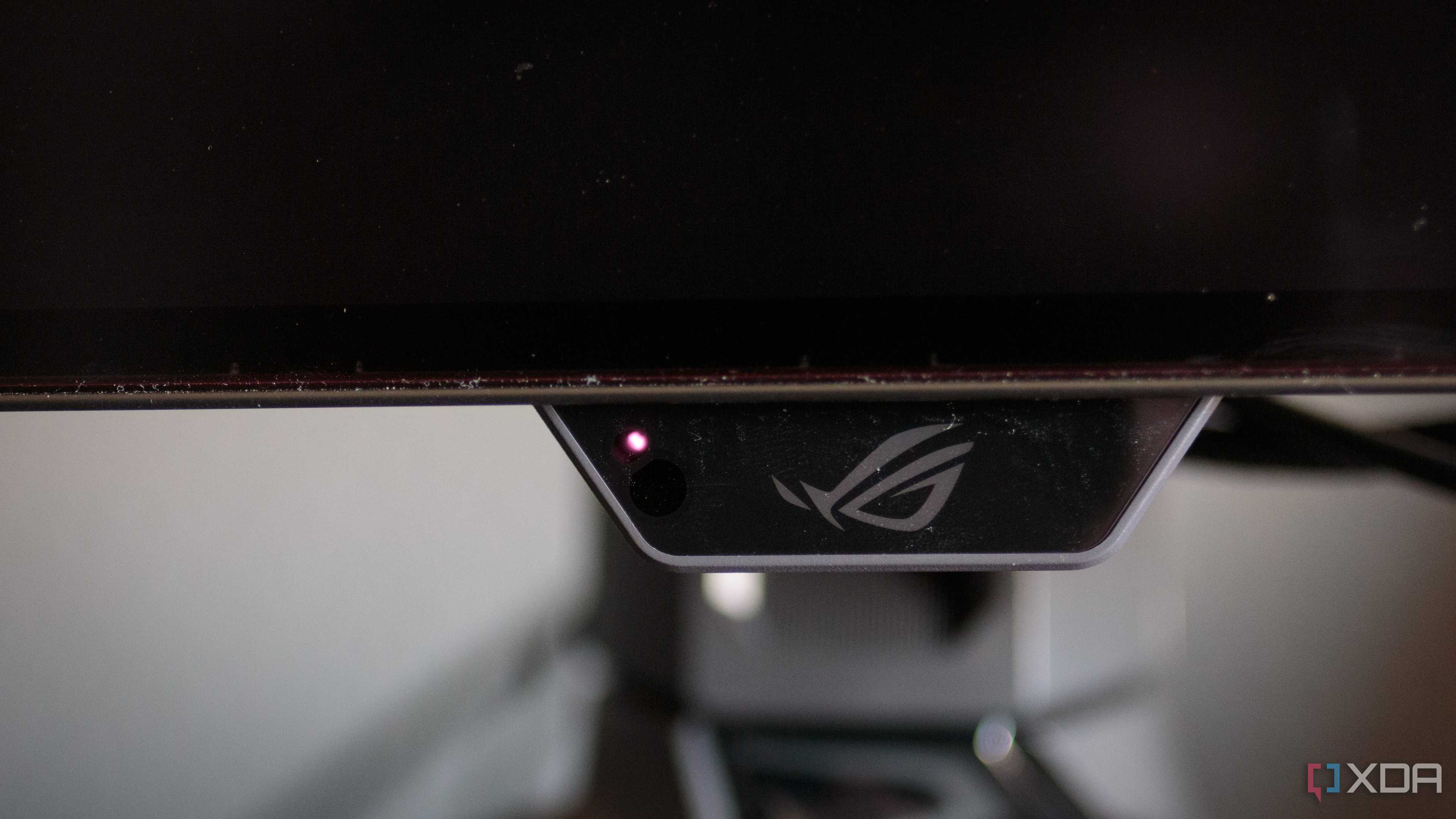 The proximity sensor on the chin of the ASUS ROG PG32UCDP.