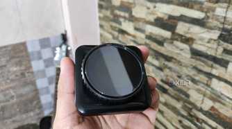 A person holding the 1.3-inch IPS Display module of the Cooler Master MasterHUB