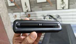 A person holding the 2-Roller module of the Cooler Master MasterHUB