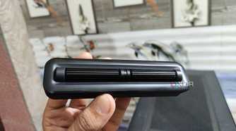 A person holding the 2-Roller module of the Cooler Master MasterHUB