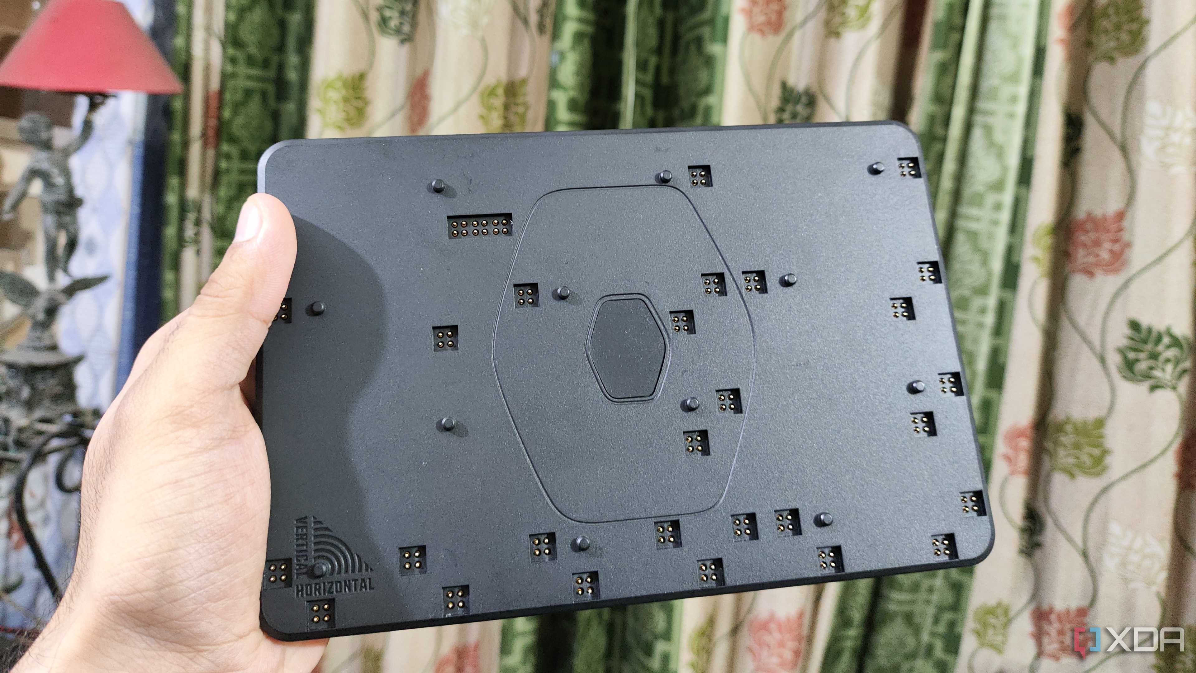 A person holding the FlexBase of the Cooler Master MasterHUB