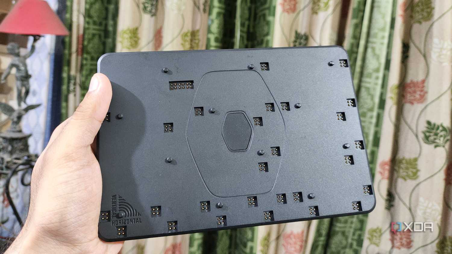 A person holding the FlexBase of the Cooler Master MasterHUB