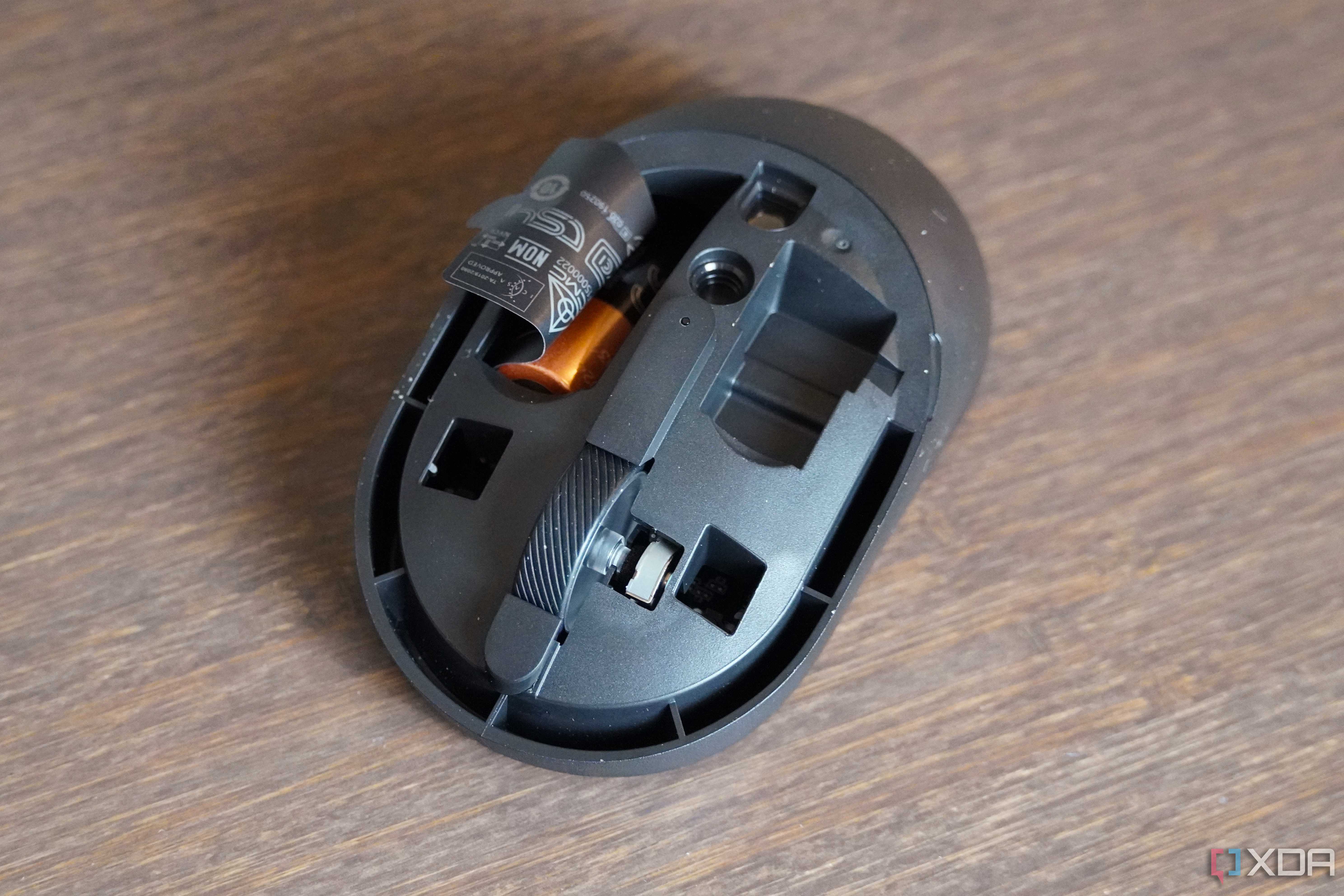 The Dell KM555 mouse with the top cover removed.